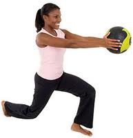 Woman lunging with workout ball